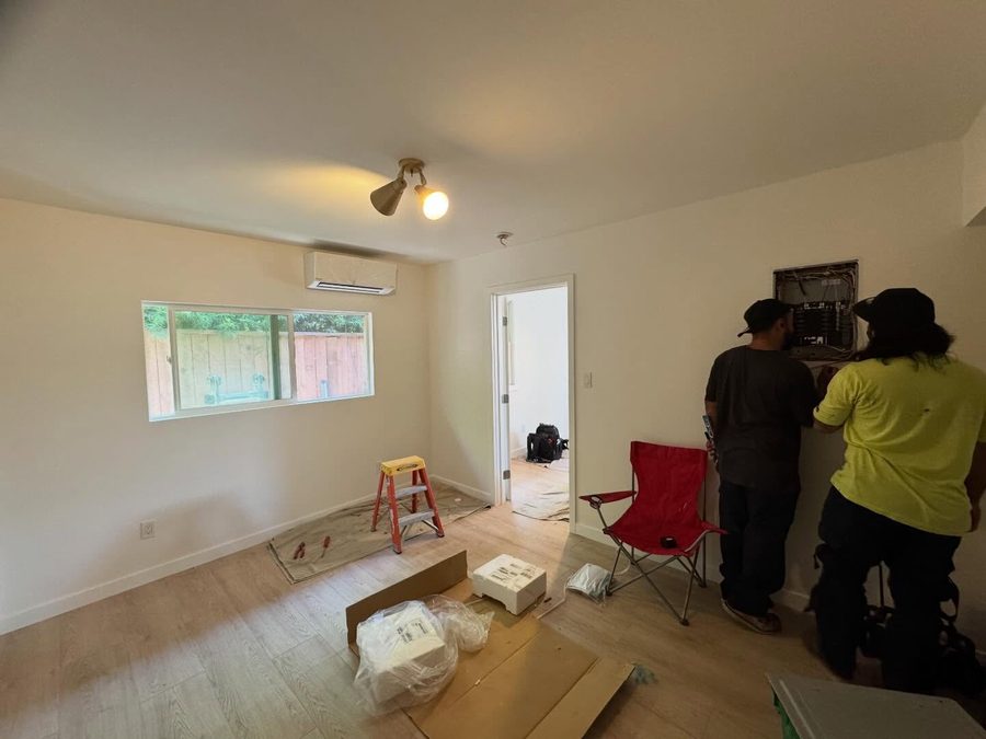 310 HVAC crew wiring the electrical panel during a mini-split installation