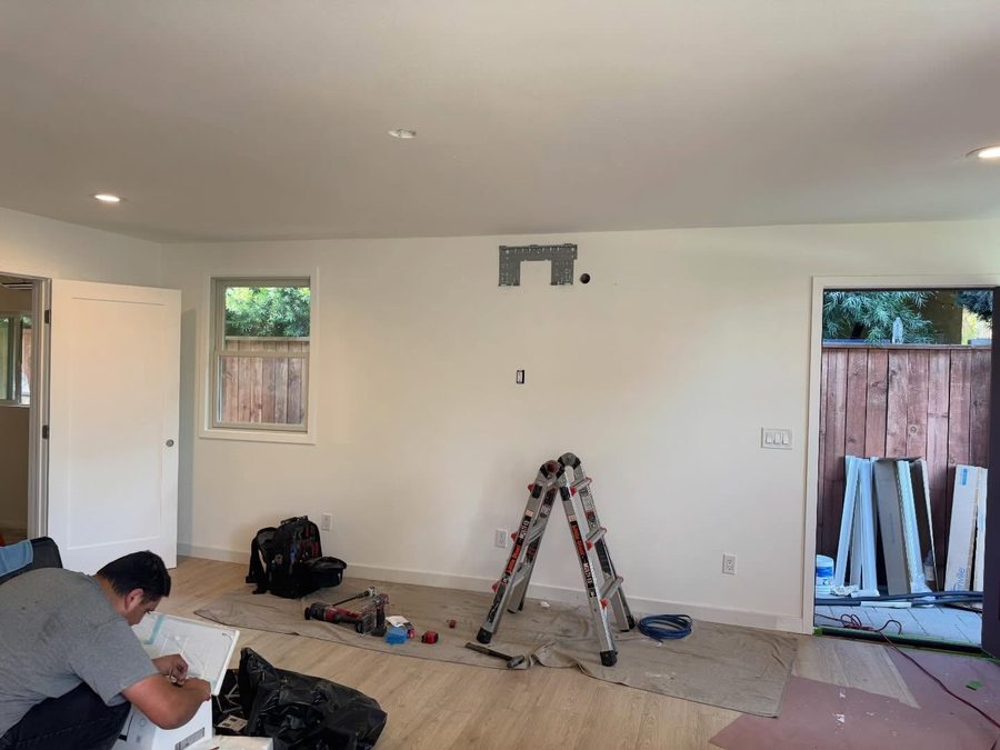 310 HVAC technician prepping a ductless mini-split installation inside a Los Angeles home
